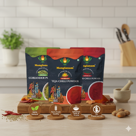 Three packets of Mangalam spices on a wooden board with ingredients and branding details.