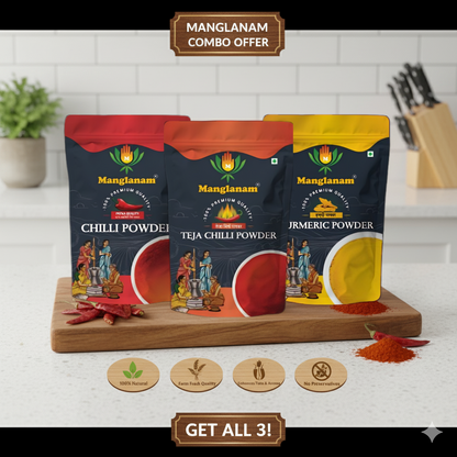Three packages of Manglanam spices on a wooden board with a kitchen background.